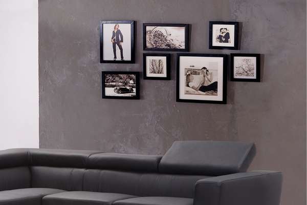 Black Sofa In Living Room With Gallery Wall